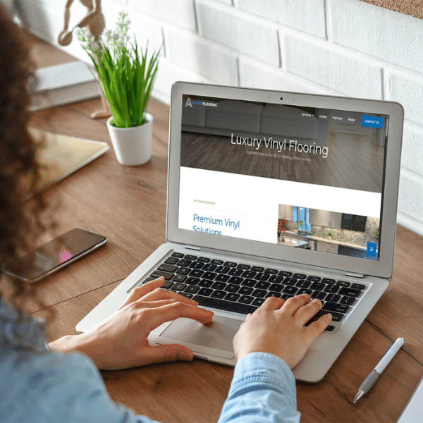 Flooring contractor shaking hands with homeowner after installation